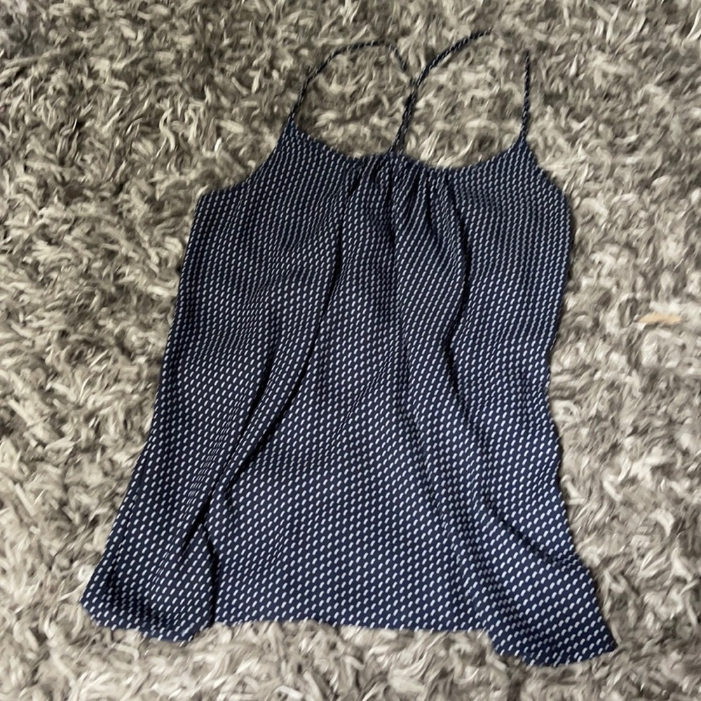 Navy blue and white polka doted shirt